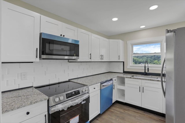 39703 Maysville Greendale Rd, Logan, OH 43138 - kitchen with stainless steel appliances, white cabinets, and recessed lighting