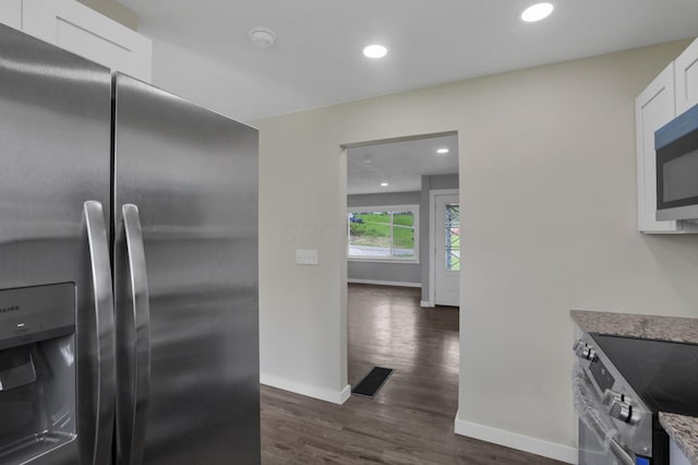 39703 Maysville Greendale Rd, Logan, OH 43138 - kitchen with appliances with stainless steel finishes, dark wood-style floors, white cabinets, light stone countertops, and recessed lighting