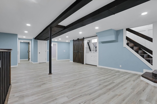 39703 Maysville Greendale Rd, Logan, OH 43138 - finished below grade area featuring a barn door, stairway, light wood-type flooring, recessed lighting, and separate washer and dryer