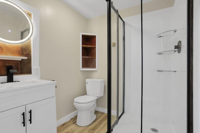 39703 Maysville Greendale Rd, Logan, OH 43138 - bathroom featuring a stall shower, wood finished floors, and vanity