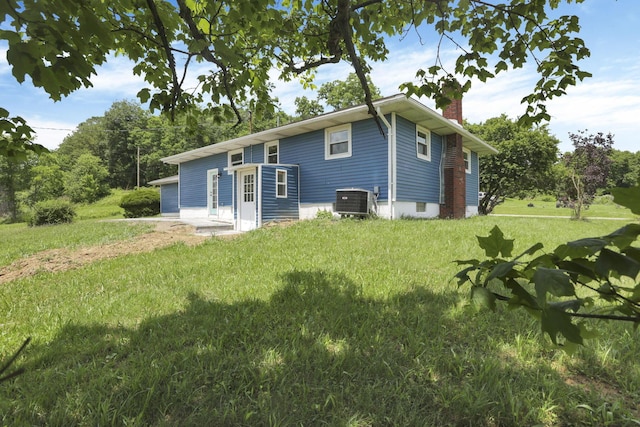 39703 Maysville Greendale Rd, Logan, OH 43138 - rear view of property featuring a chimney and a lawn