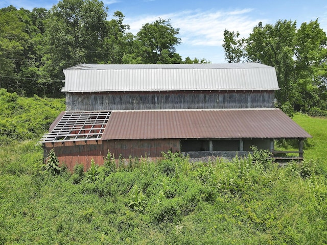 39703 Maysville Greendale Rd, Logan, OH 43138 - view of side of home with a metal roof and an outdoor structure