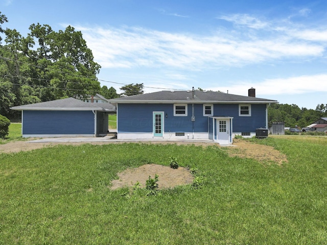 39703 Maysville Greendale Rd, Logan, OH 43138 - back of house featuring a lawn, a chimney, and a patio area