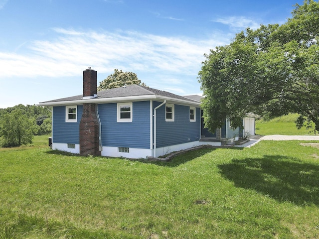 39703 Maysville Greendale Rd, Logan, OH 43138 - view of home's exterior with a chimney and a yard