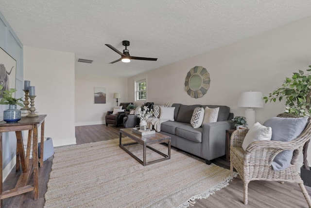 101 Circle Dr, Baltimore, OH 43105 - living room featuring wood finished floors, ceiling fan, and a textured ceiling