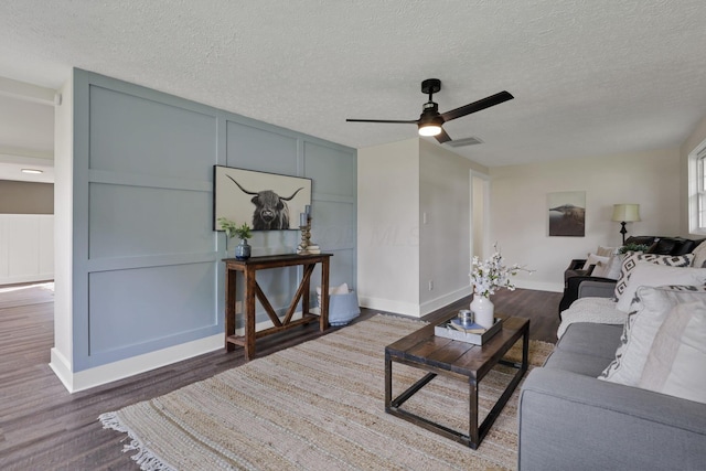 101 Circle Dr, Baltimore, OH 43105 - living room with wood finished floors, ceiling fan, and a textured ceiling