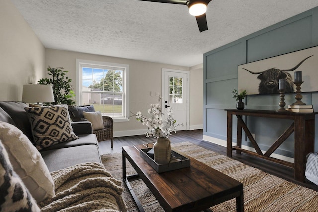 101 Circle Dr, Baltimore, OH 43105 - living area featuring a ceiling fan, dark wood-style flooring, and a textured ceiling