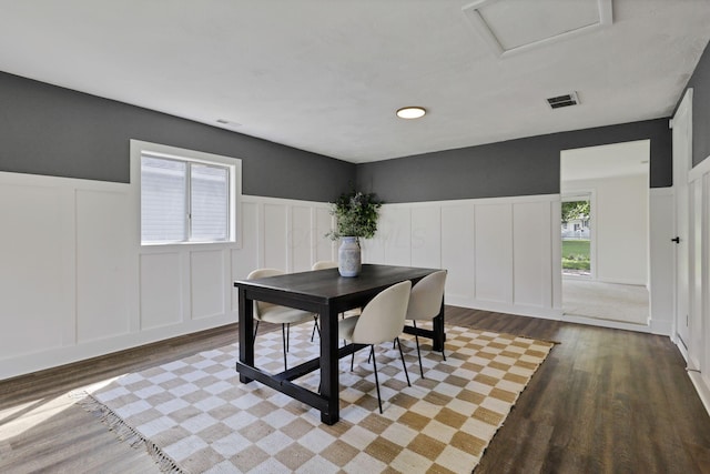 101 Circle Dr, Baltimore, OH 43105 - dining room with a decorative wall, wood finished floors, wainscoting, and attic access