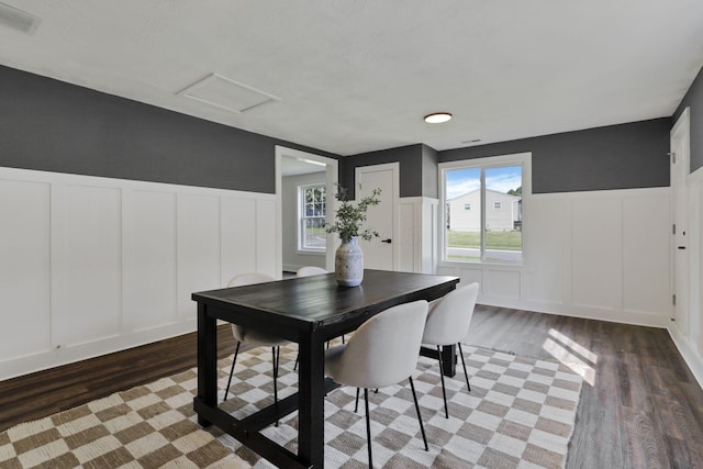 101 Circle Dr, Baltimore, OH 43105 - dining room with a decorative wall, wood finished floors, wainscoting, and attic access