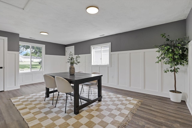 101 Circle Dr, Baltimore, OH 43105 - dining area with a decorative wall, wainscoting, and wood finished floors