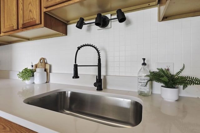 101 Circle Dr, Baltimore, OH 43105 - kitchen view of brown cabinets, tasteful backsplash, and light countertops