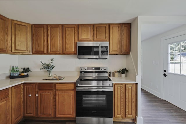 101 Circle Dr, Baltimore, OH 43105 - kitchen with appliances with stainless steel finishes, brown cabinets, and light countertops