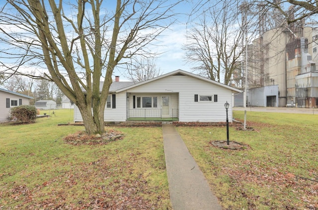 210 S Front St, Alger, OH 45812 - view of front of property featuring a front lawn, covered porch, and a chimney