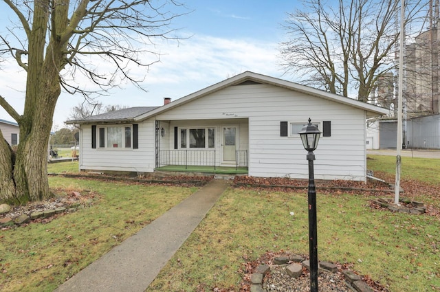 210 S Front St, Alger, OH 45812 - view of front facade with covered porch and a front lawn