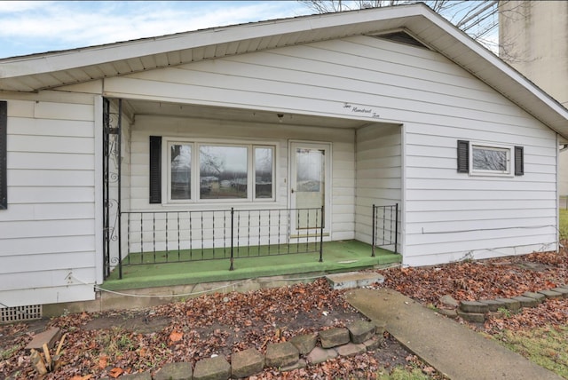 210 S Front St, Alger, OH 45812 - view of exterior entry with a chimney