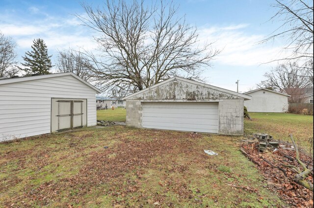 210 S Front St, Alger, OH 45812 - view of yard featuring an outbuilding and a garage