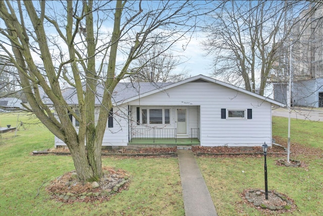 210 S Front St, Alger, OH 45812 - view of front of home with a front lawn and covered porch