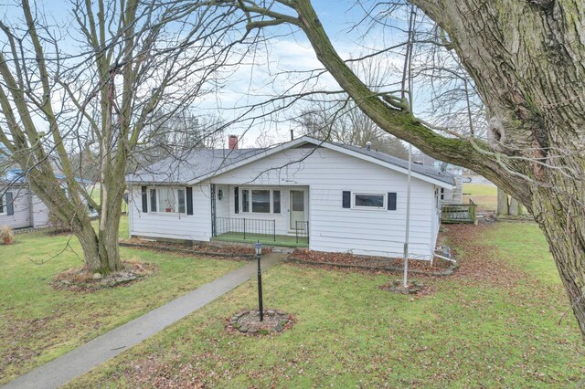 210 S Front St, Alger, OH 45812 - single story home featuring a front lawn and a chimney