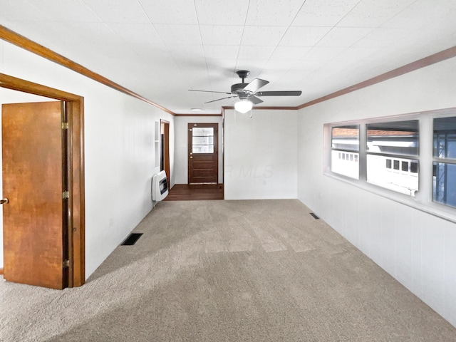 264 Lawrence Ave, Columbus, OH 43228 - carpeted empty room featuring ceiling fan, crown molding, a wall mounted AC, and heating unit