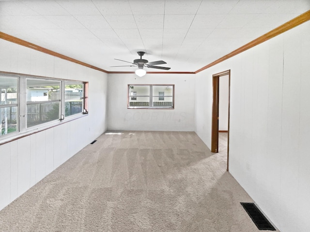 264 Lawrence Ave, Columbus, OH 43228 - carpeted spare room with a ceiling fan and crown molding