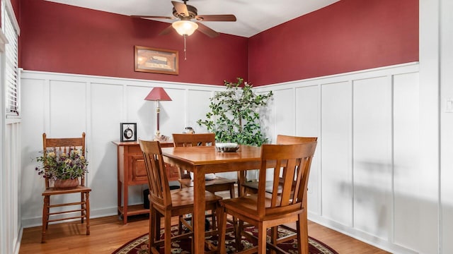 452 Jefferson Rd, Newark, OH 43055 - dining area with a decorative wall, a ceiling fan, light wood-type flooring, and wainscoting