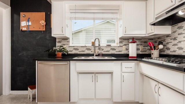 452 Jefferson Rd, Newark, OH 43055 - kitchen with under cabinet range hood, stainless steel appliances, backsplash, and white cabinets