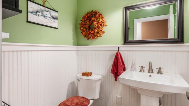452 Jefferson Rd, Newark, OH 43055 - bathroom featuring a wainscoted wall and toilet