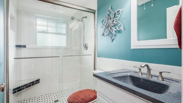 452 Jefferson Rd, Newark, OH 43055 - bathroom with a stall shower, vanity, and a wainscoted wall