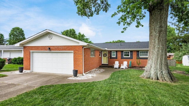 452 Jefferson Rd, Newark, OH 43055 - ranch-style house with an attached garage, driveway, brick siding, and a front lawn