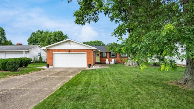 452 Jefferson Rd, Newark, OH 43055 - ranch-style house featuring an attached garage, brick siding, concrete driveway, and a front yard