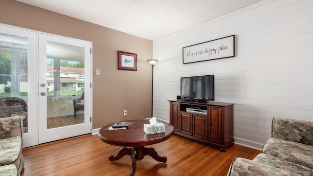 452 Jefferson Rd, Newark, OH 43055 - living room with french doors, light wood-style flooring, and wooden walls