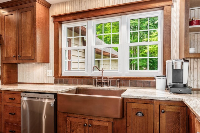 8622 Lott Rd, Marengo, OH 43334 - kitchen with stainless steel dishwasher, brown cabinetry, and light stone counters