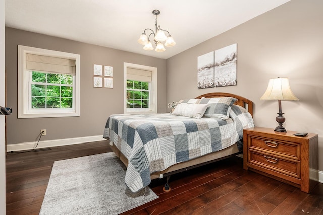8622 Lott Rd, Marengo, OH 43334 - bedroom featuring dark wood-style flooring and a chandelier