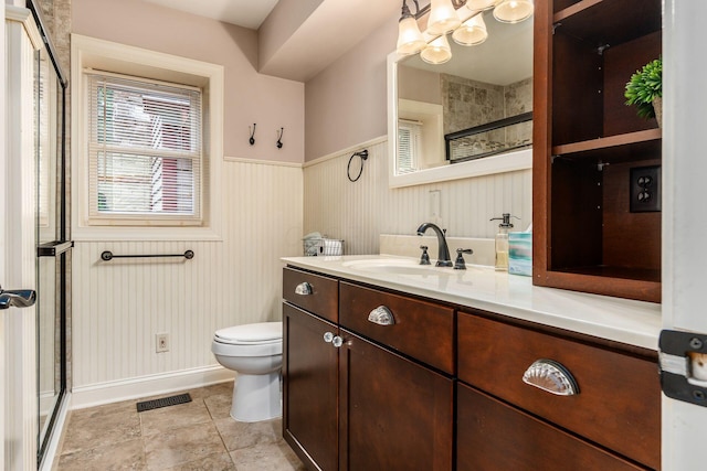 8622 Lott Rd, Marengo, OH 43334 - bathroom featuring a shower stall, vanity, a wainscoted wall, and a chandelier