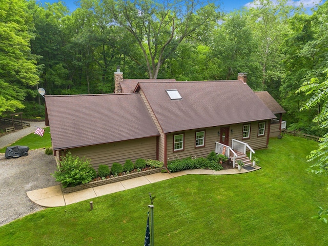 8622 Lott Rd, Marengo, OH 43334 - view of front facade with a chimney, roof with shingles, and a front yard