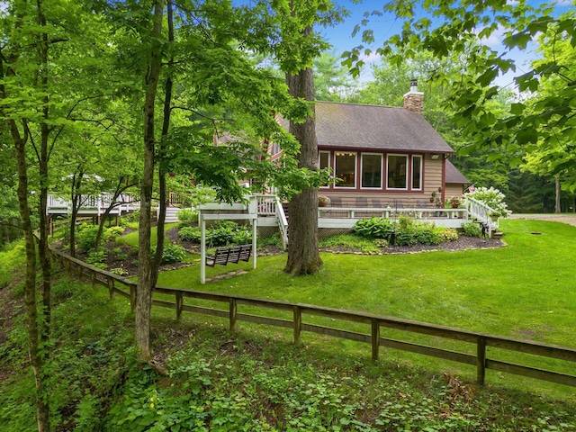 8622 Lott Rd, Marengo, OH 43334 - back of house with a shingled roof, a chimney, and a deck