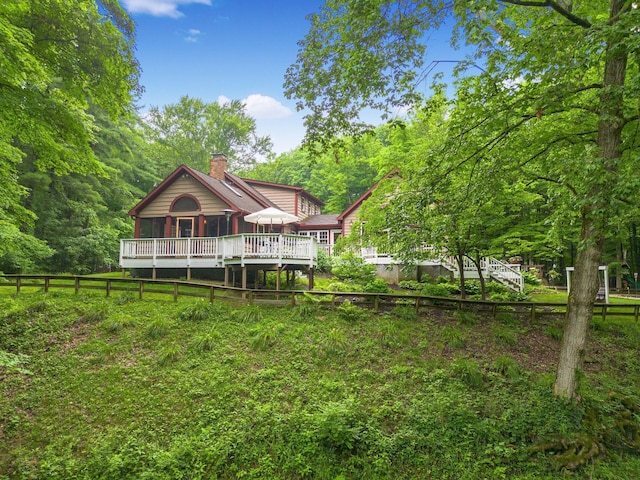 8622 Lott Rd, Marengo, OH 43334 - rear view of property with a chimney and a wooden deck