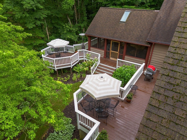 8622 Lott Rd, Marengo, OH 43334 - deck featuring outdoor dining space and a sunroom