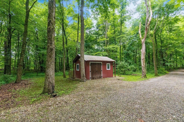 8622 Lott Rd, Marengo, OH 43334 - view of shed featuring a wooded view