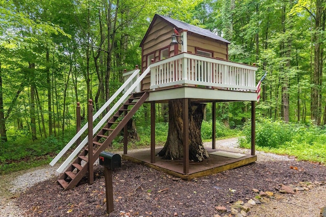 8622 Lott Rd, Marengo, OH 43334 - view of play area featuring a deck, stairs, and a wooded view