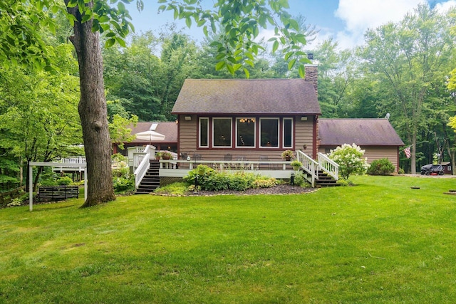 8622 Lott Rd, Marengo, OH 43334 - back of house featuring a shingled roof, a deck, a lawn, a chimney, and stairway