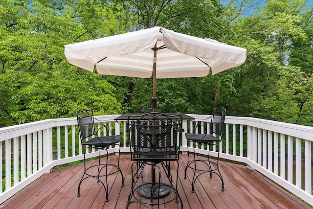 8622 Lott Rd, Marengo, OH 43334 - deck with outdoor dining space and view of scattered trees