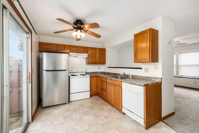 884 Annagladys Dr Unit F2, Columbus, OH 43085 - kitchen with white appliances, a ceiling fan, brown cabinets, and under cabinet range hood