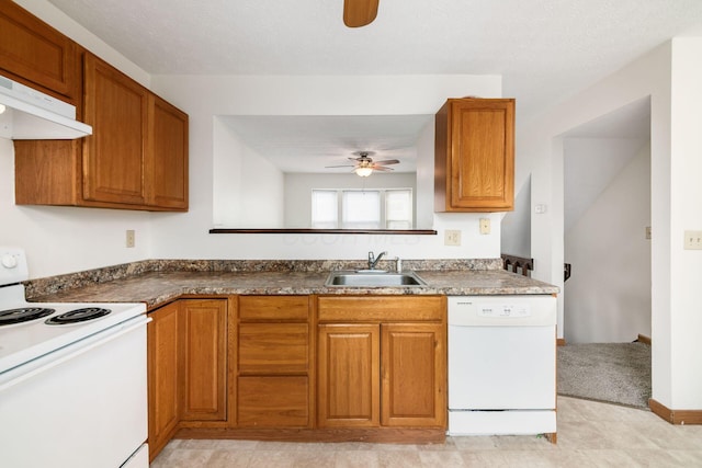 884 Annagladys Dr Unit F2, Columbus, OH 43085 - kitchen featuring white appliances, ceiling fan, range hood, and brown cabinets