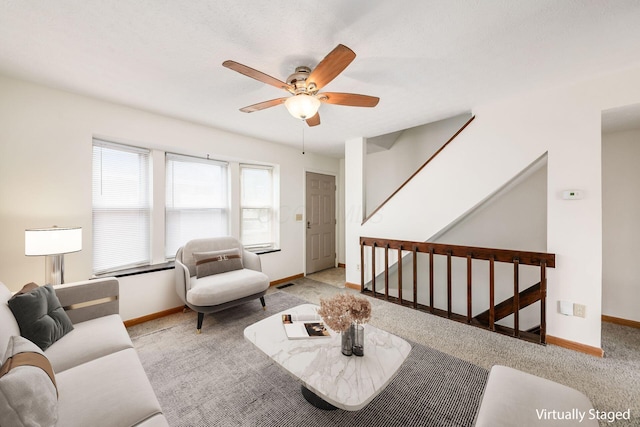 884 Annagladys Dr Unit F2, Columbus, OH 43085 - living room with a ceiling fan, carpet flooring, and stairway