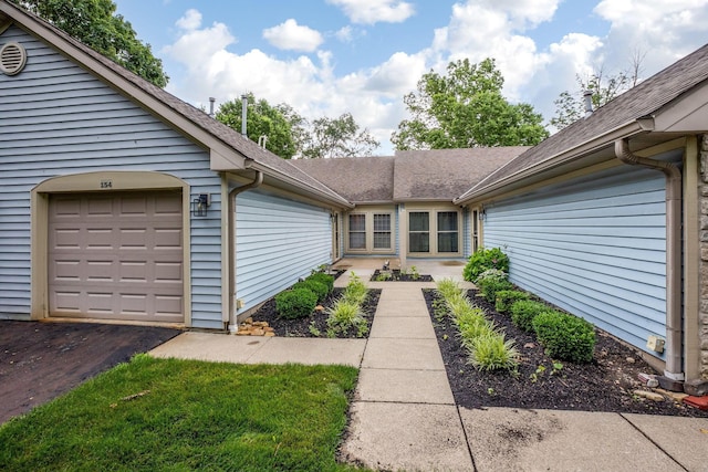 154 Oak Creek Pl, Columbus, OH 43230 - view of exterior entry with roof with shingles