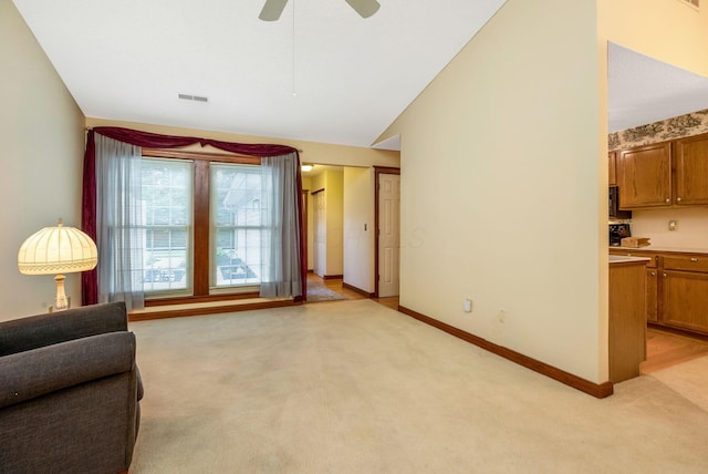 154 Oak Creek Pl, Columbus, OH 43230 - living area featuring light carpet, ceiling fan, and vaulted ceiling