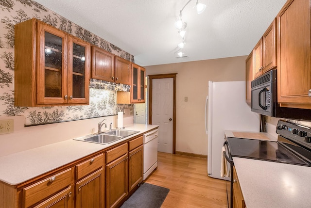 154 Oak Creek Pl, Columbus, OH 43230 - kitchen with electric range, black microwave, dishwasher, light wood-type flooring, and light countertops