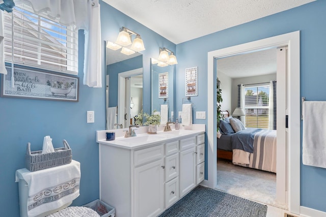 211 Talla Rd S, Delaware, OH 43015 - ensuite bathroom with double vanity and a textured ceiling