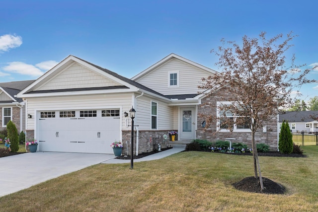 211 Talla Rd S, Delaware, OH 43015 - traditional-style home with stone siding, an attached garage, concrete driveway, and a front lawn